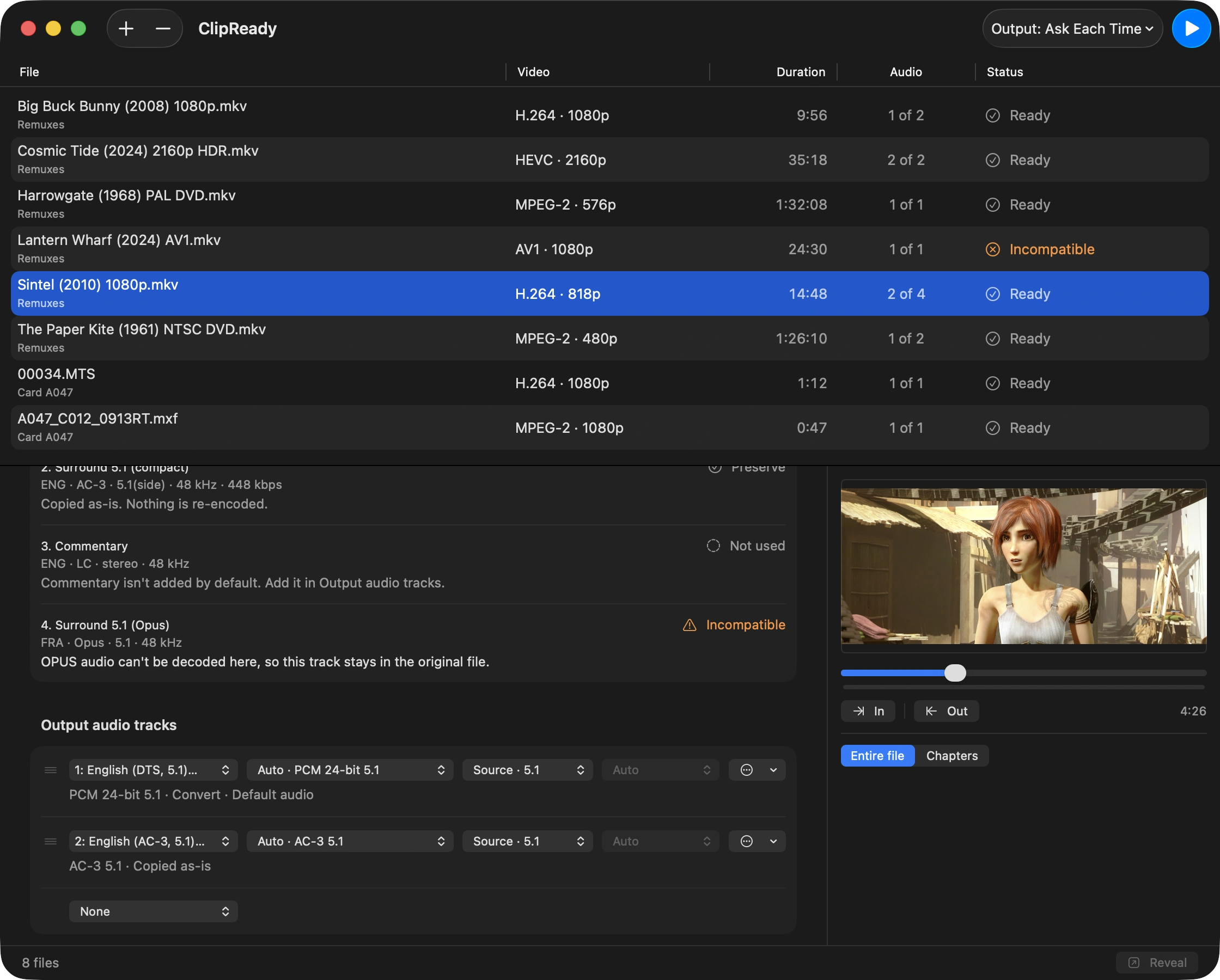 The Output audio tracks table: two rows with aligned Source, Codec, Mixdown, and Bitrate columns, the first summarized as “PCM 24-bit 5.1 · Convert · Default audio” and the second as “AC-3 5.1 · Copied as-is”, with a trailing None row that adds a track.